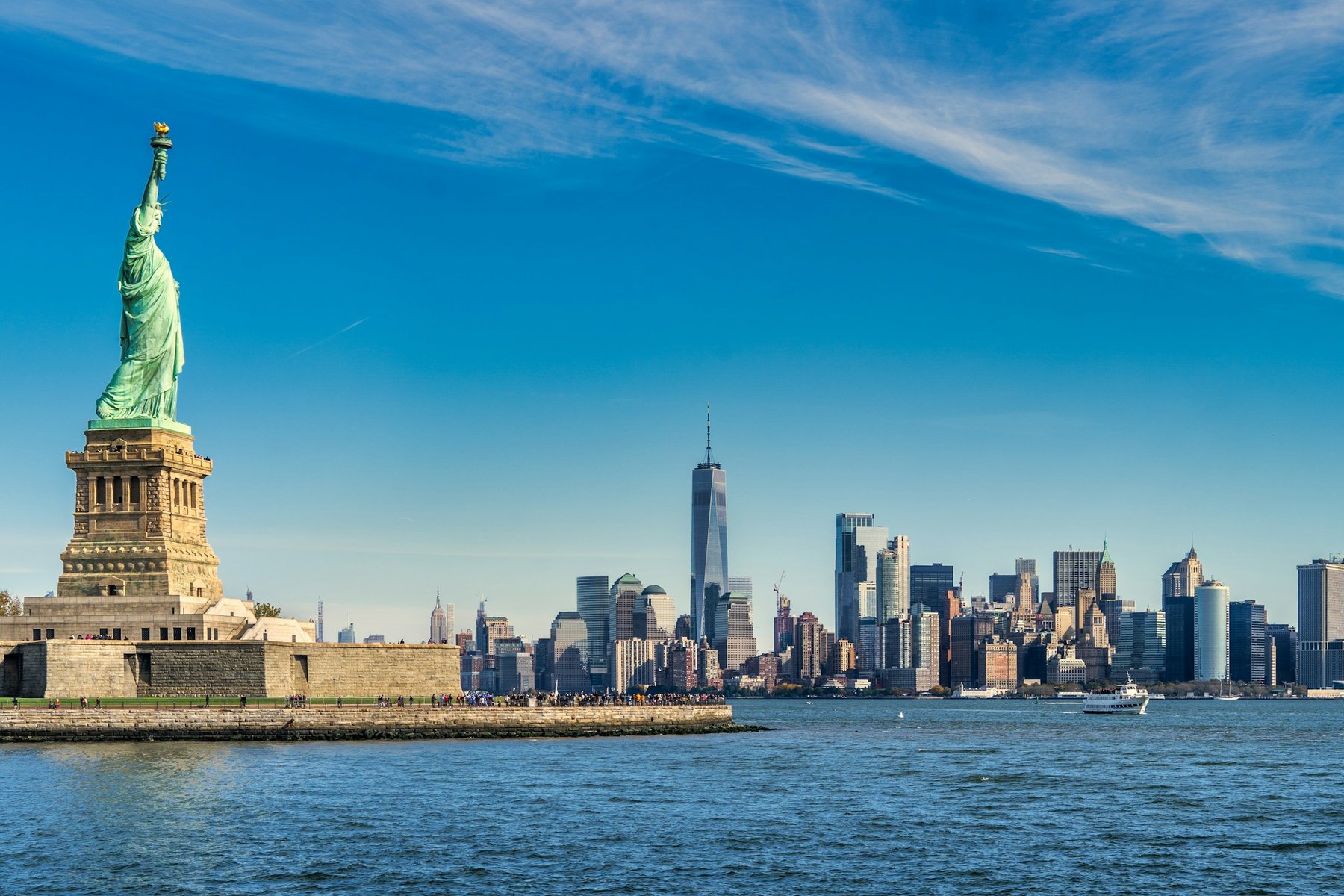 The Statue of Liberty in front of the Manhattan skyline